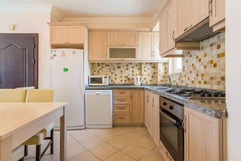 Deluxe Apartment, 2 Bedrooms | Private kitchen | Fridge, microwave, oven, dishwasher