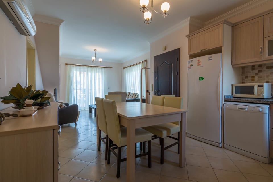 Deluxe Apartment, 2 Bedrooms | Private kitchen | Fridge, microwave, oven, dishwasher