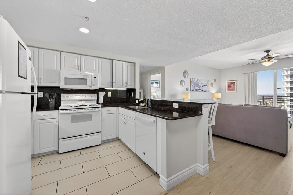 Kitchen with upgraded tile and stunning granite countertops