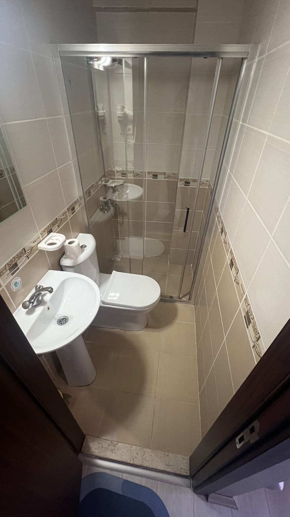 Shower, hair dryer, slippers, towels