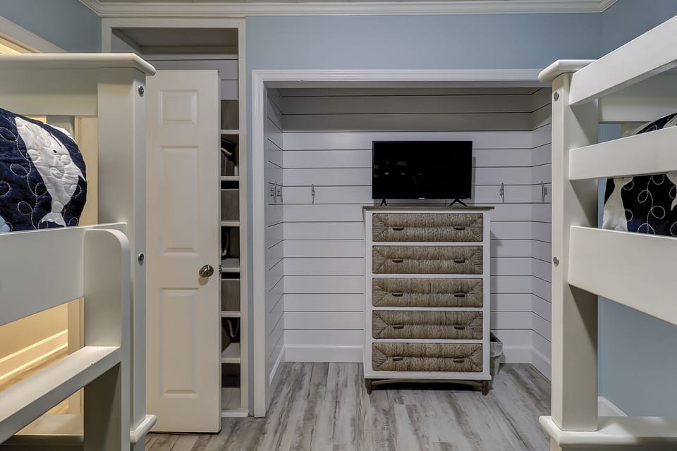 Kids room with four bunk beds and flat screen TV. - Kids room with four bunk beds and flat screen TV.