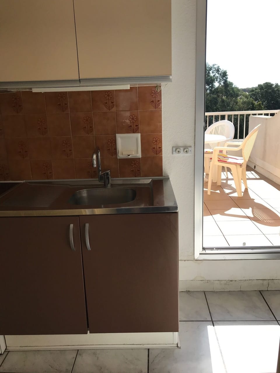 Kitchen and East facing terrace.