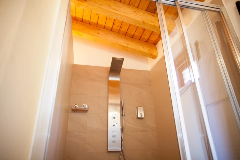Shower, designer toiletries, hair dryer, bathrobes
