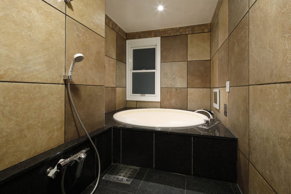Double Room, 1 King Bed, Non Smoking | Bathroom | Separate tub and shower, deep soaking tub, free toiletries, hair dryer
