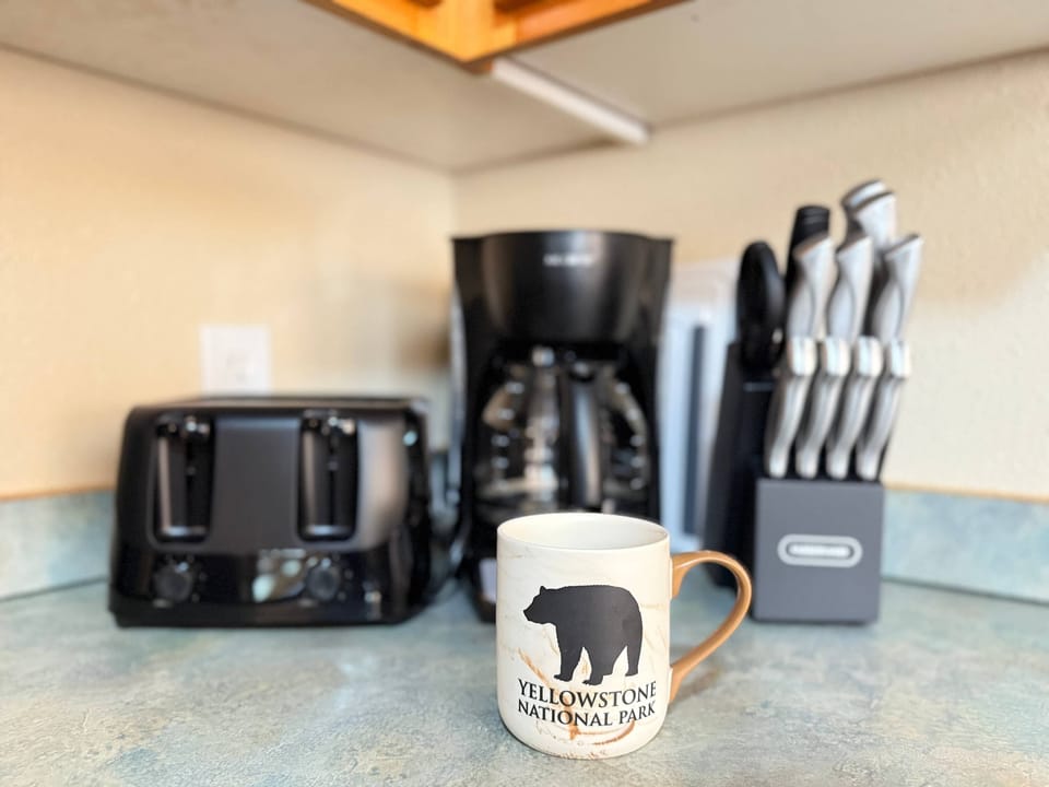 Toaster, drip coffee maker and knife block.
