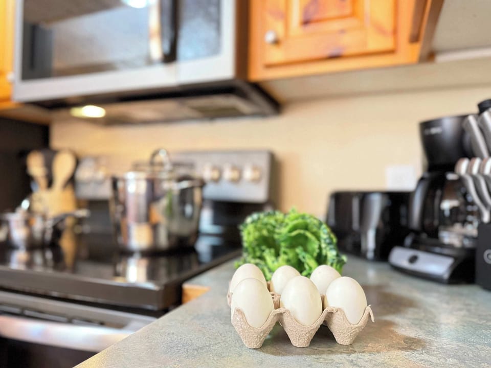 The openness of the kitchen makes it easy to chat with friends or family while cooking, or to catch the glow of the fire and the sound of laughter as you move between the rooms.