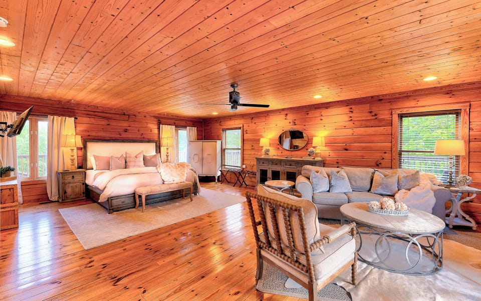 Bedroom 1: King Bed, Smart TV, Sitting Area, Full ensuite Bathroom with Shower and Tub