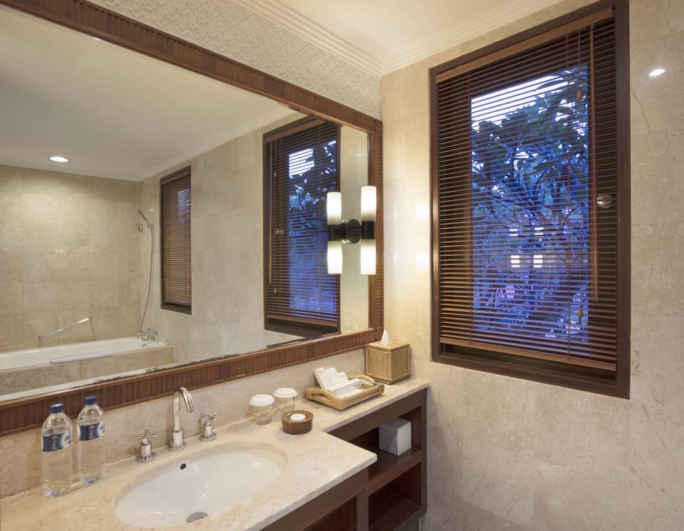 Separate tub and shower, hair dryer, bathrobes, slippers