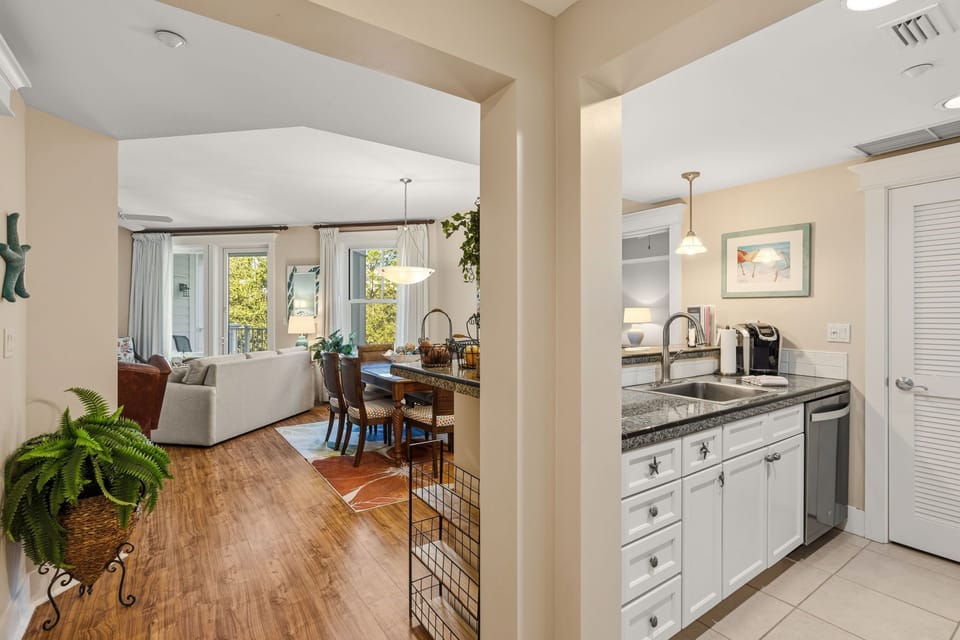 Entry to the condo-kitchen on right, laundry behind door in kitchen, living area