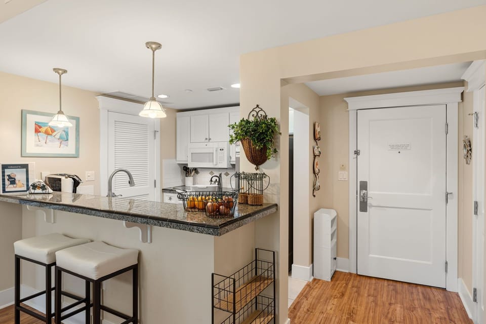 View of kitchen ...door on left to laundry room w/ full size washer & dryer