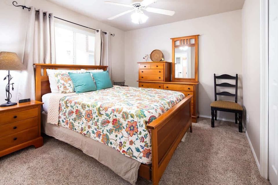 guest bedroom with a queen size bed 