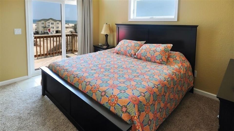 One of four King bedrooms with ocean views, private bath, and deck access.