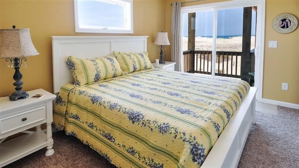 One of four King bedrooms with ocean views, private bath, and deck access.