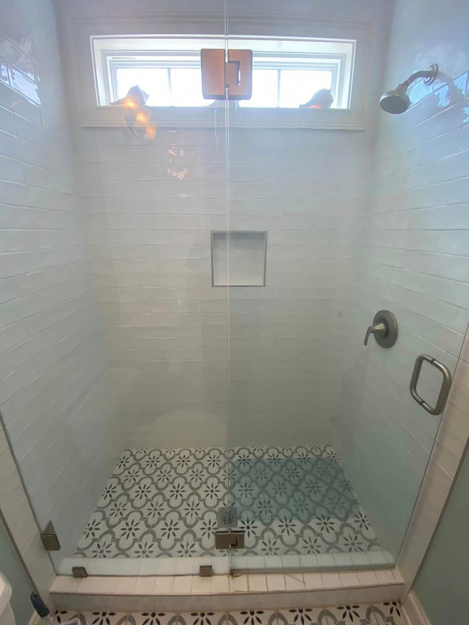 SUBWAY TILED WALK IN SHOWER WITH FRAMELESS GLASS DOORS