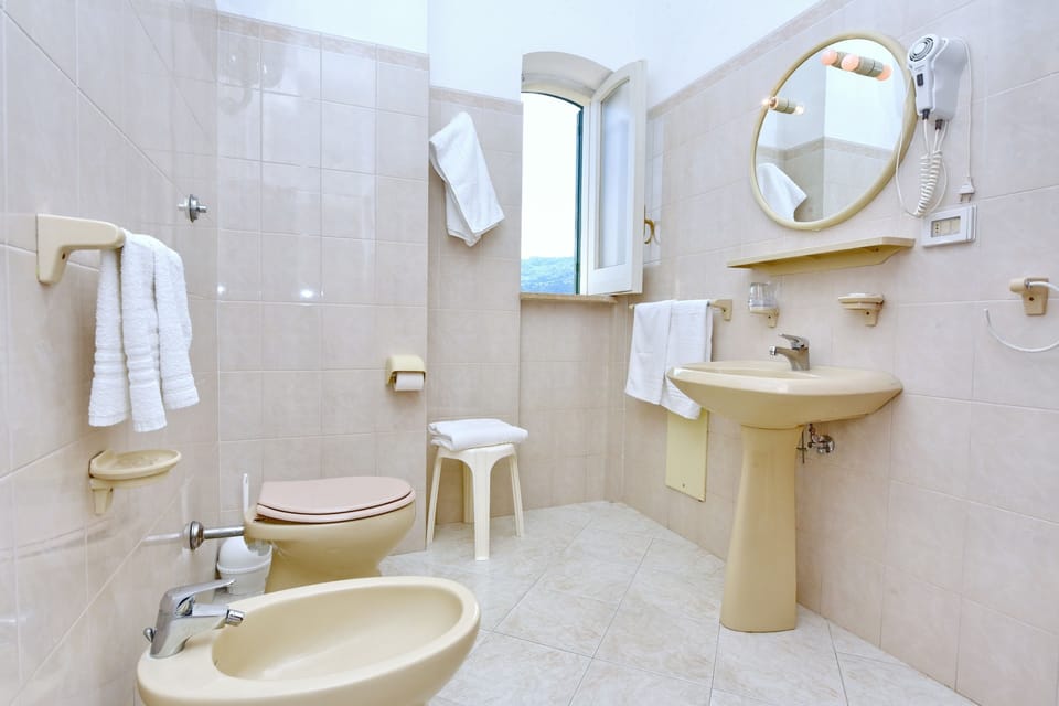 Double or Twin Room | Bathroom | Shower, free toiletries, bidet, towels