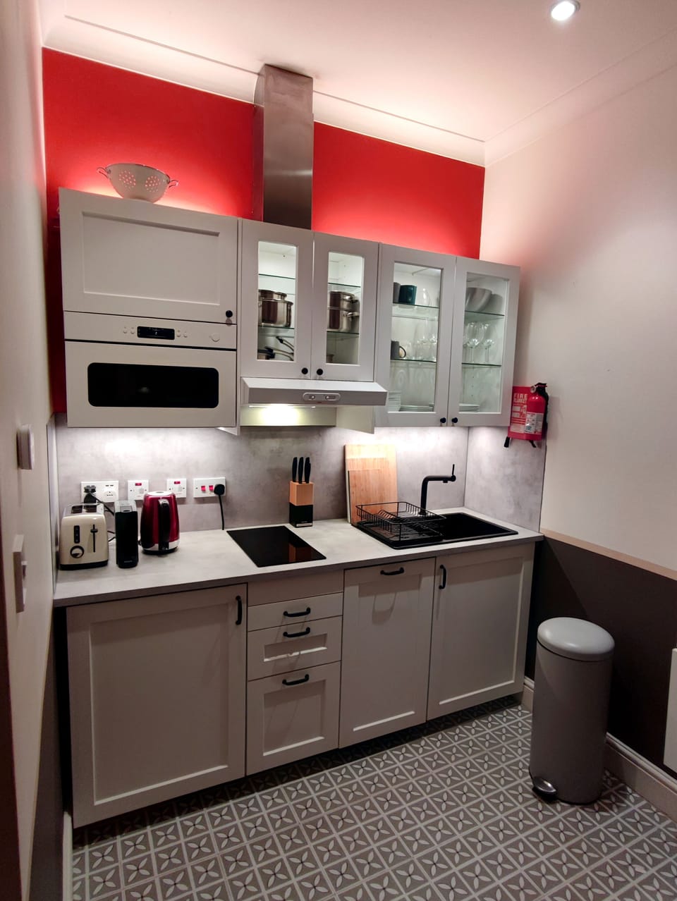 Kitchen corner with Nespresso, microwave, fridge and hob