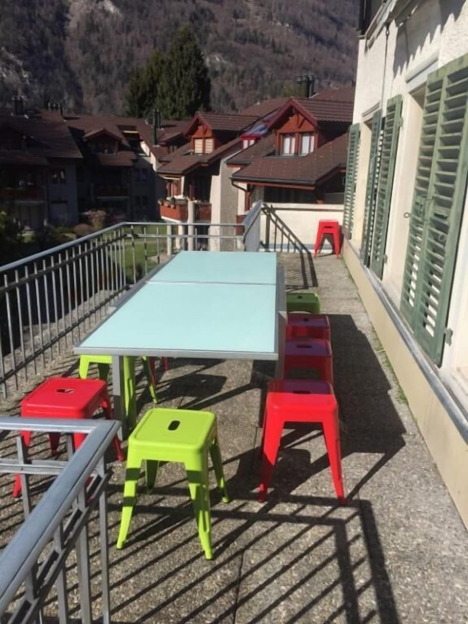 Balcony with seating for 12 and wind out shade cover.