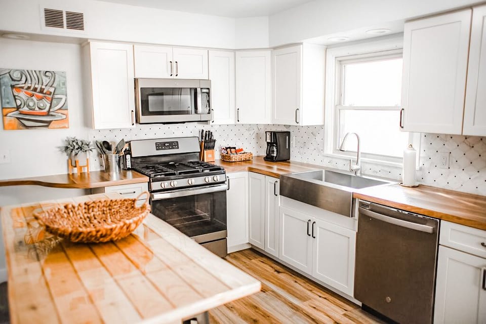 The kitchen with pleny of pots and pans to cook a great meal 
