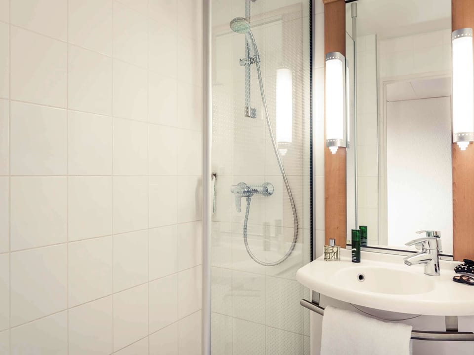 Shower, eco-friendly toiletries, hair dryer, towels