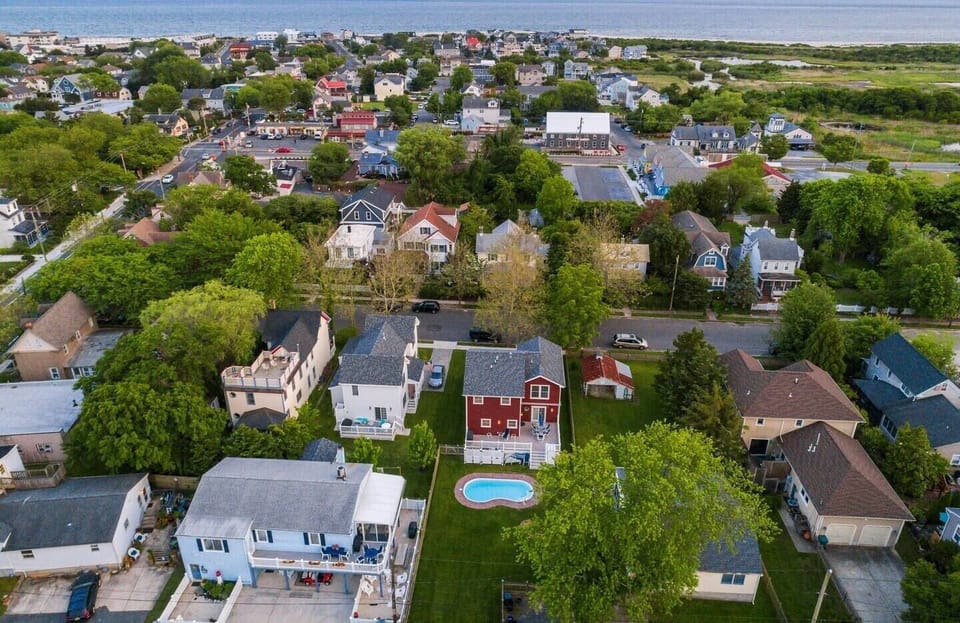 Aerial view with ocean in the background before the addition and the new pool surround.