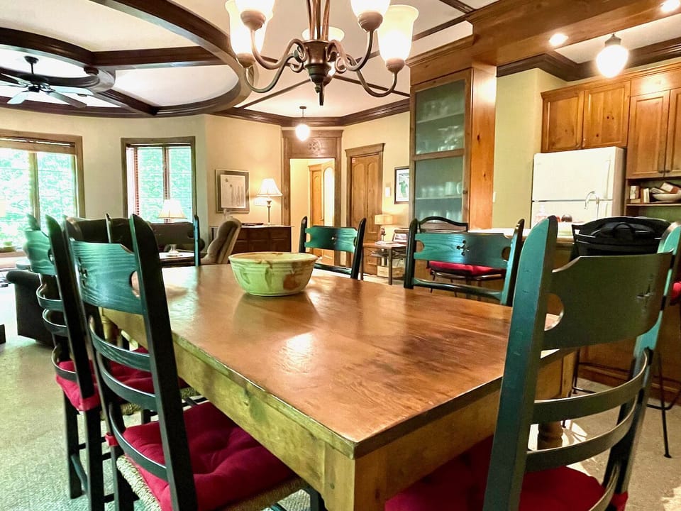 Dining room with antique, mid-19th century harvest table and seating for 6-8