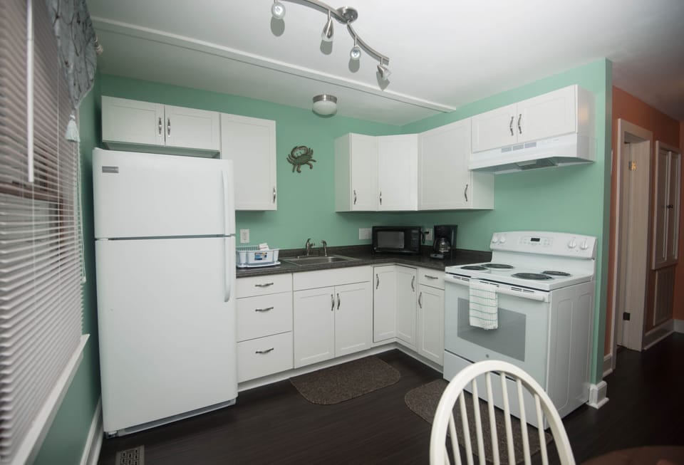 Fully equipped kitchen including microwave, crock pot and tea kettle 