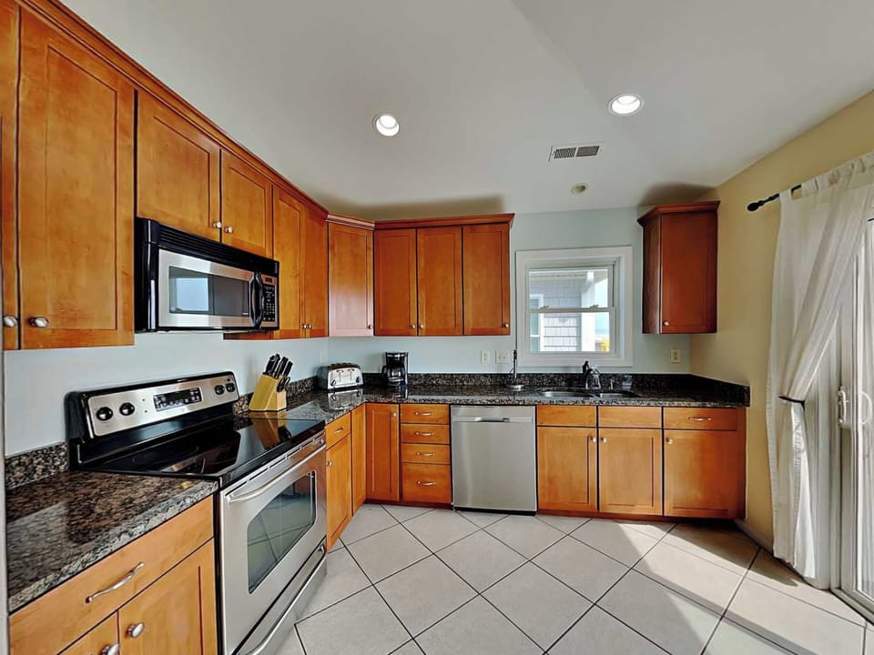 Fully Equipped Kitchen with Stainless Steel Appliances