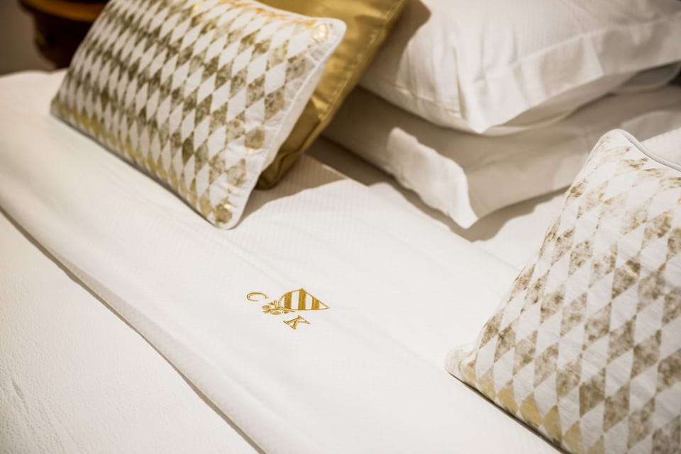 Superior Suite | Minibar, in-room safe, individually decorated, individually furnished