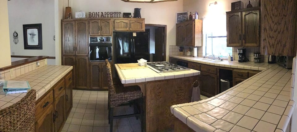 Kitchen with built ins a french door refrigerator with ice maker
