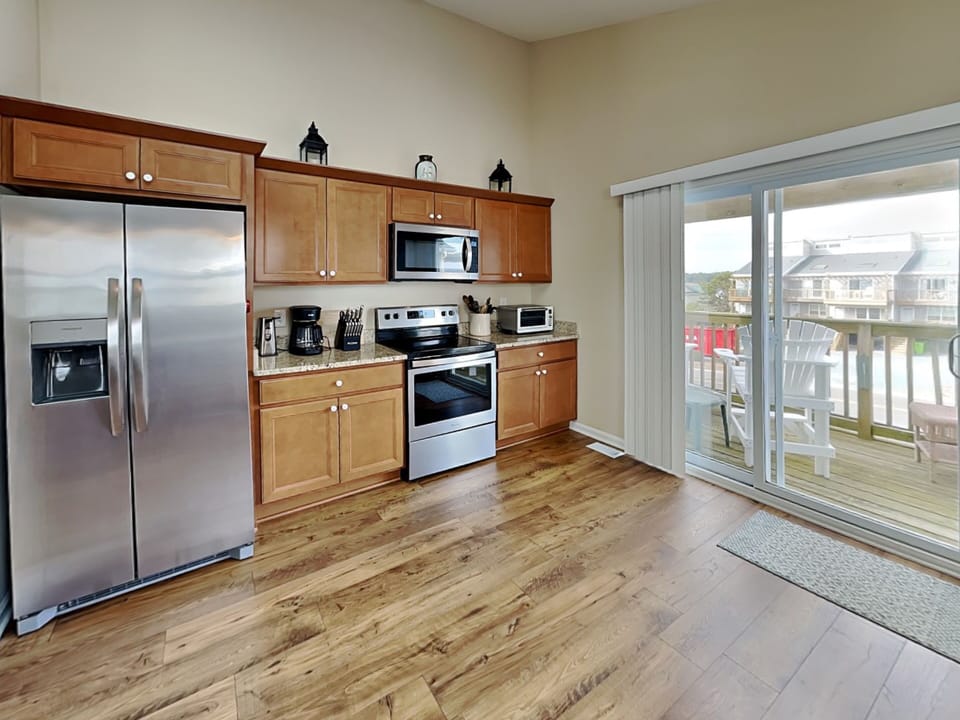 Kitchen - Fully Stocked Kitchen, Stainless Steel Appliances and Adjacent Porch