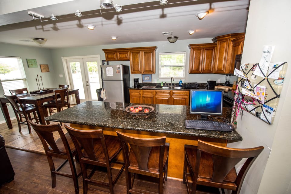 Open floor plan between kitchen, dining, and living room.