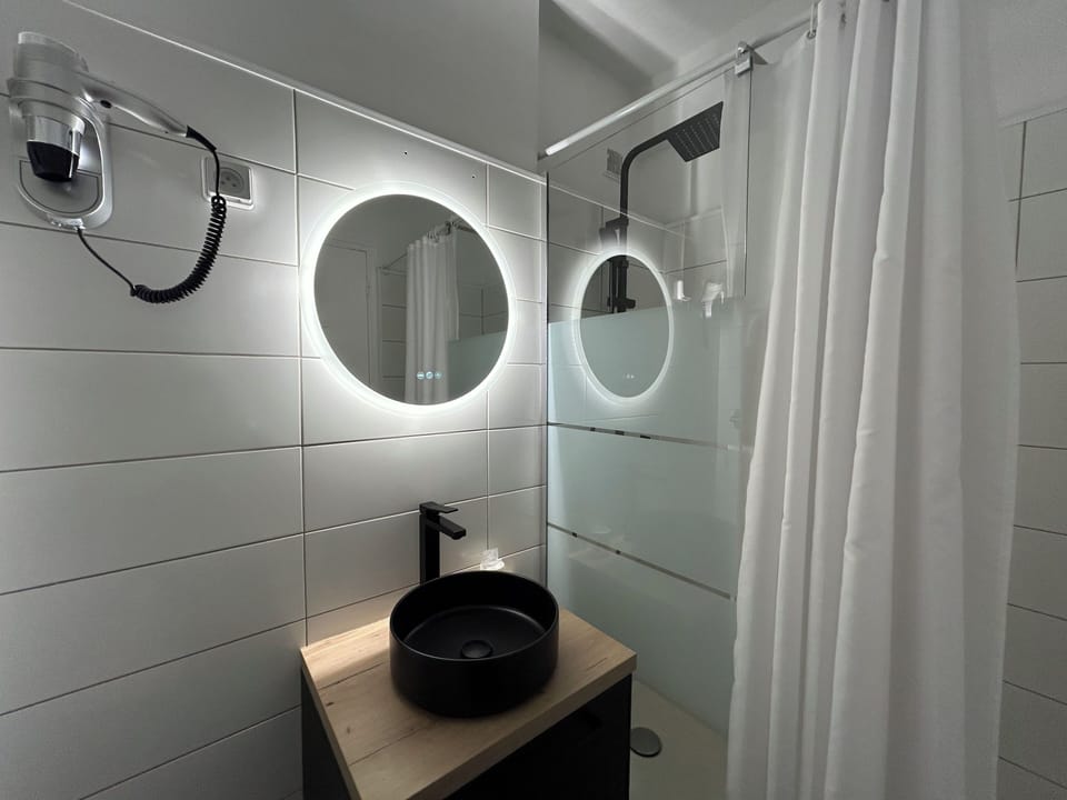 Double Room | Bathroom | Rainfall showerhead, hair dryer, towels, soap