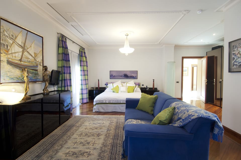 Senior Double Room | Living area | Flat-screen TV
