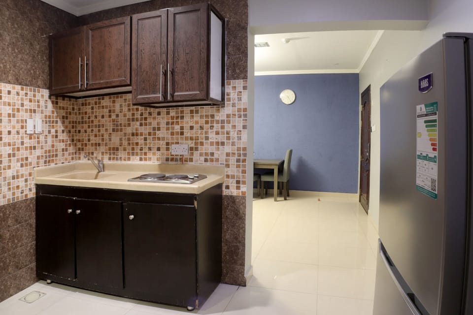 Apartment, 2 Bedrooms | Private kitchen | Fridge, microwave, electric kettle, cleaning supplies