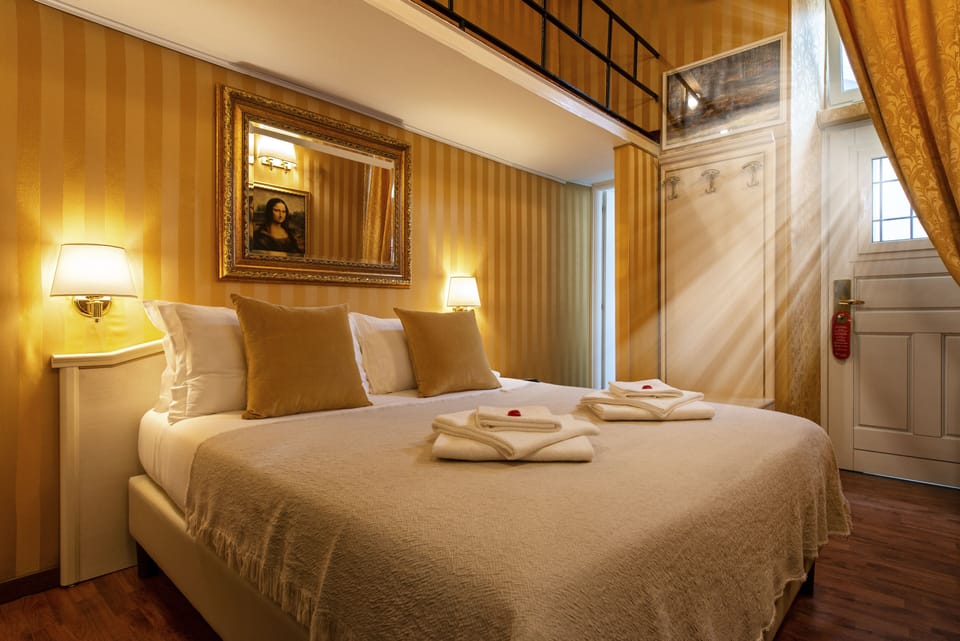 Family Quadruple Room, Private Bathroom | Free minibar, in-room safe, desk, blackout drapes