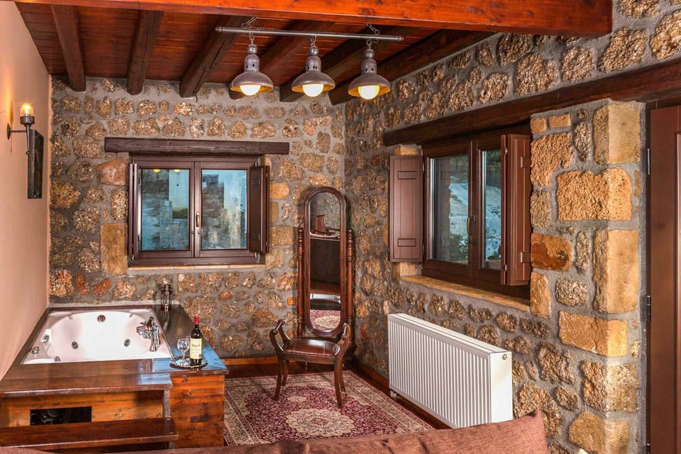 Deluxe Suite, Jetted Tub | Living area | 32-inch LCD TV with digital channels, TV