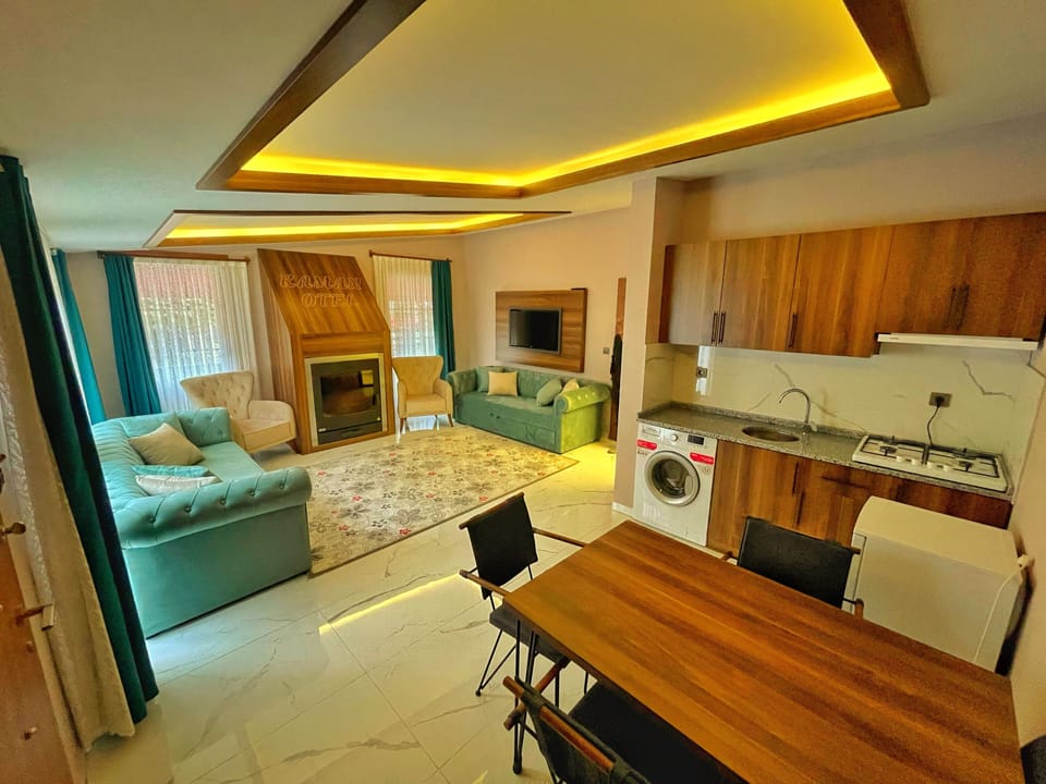 Deluxe Condo, 1 Bedroom | Living area | LCD TV