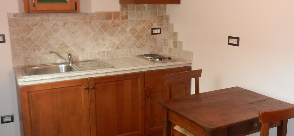 Apartment, 1 Bedroom | Private kitchen | Full-size fridge, stovetop, coffee/tea maker, cookware/dishes/utensils