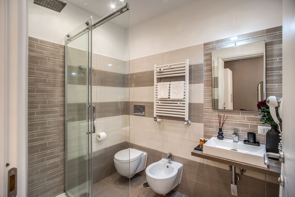 Shower, eco-friendly toiletries, hair dryer, slippers