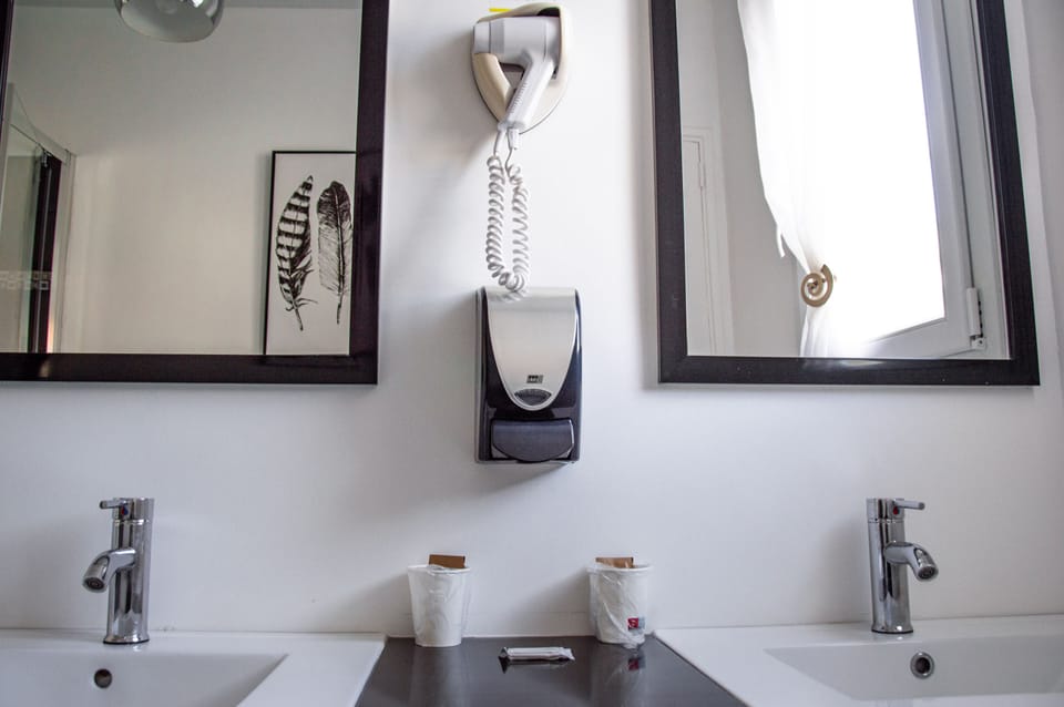 Twin Room | Bathroom | Hair dryer, towels