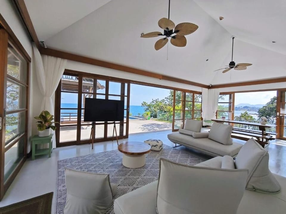 Luxury Villa, 5 Bedrooms, Ocean View, Sea Facing (Oceanfront Pool Villa with Kitchen) | Living area | 55-cm LED TV with digital channels, pay movies