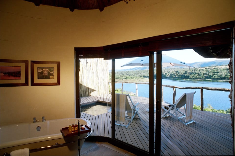 Impala Chalet | Bathroom | Separate tub and shower, slippers, towels