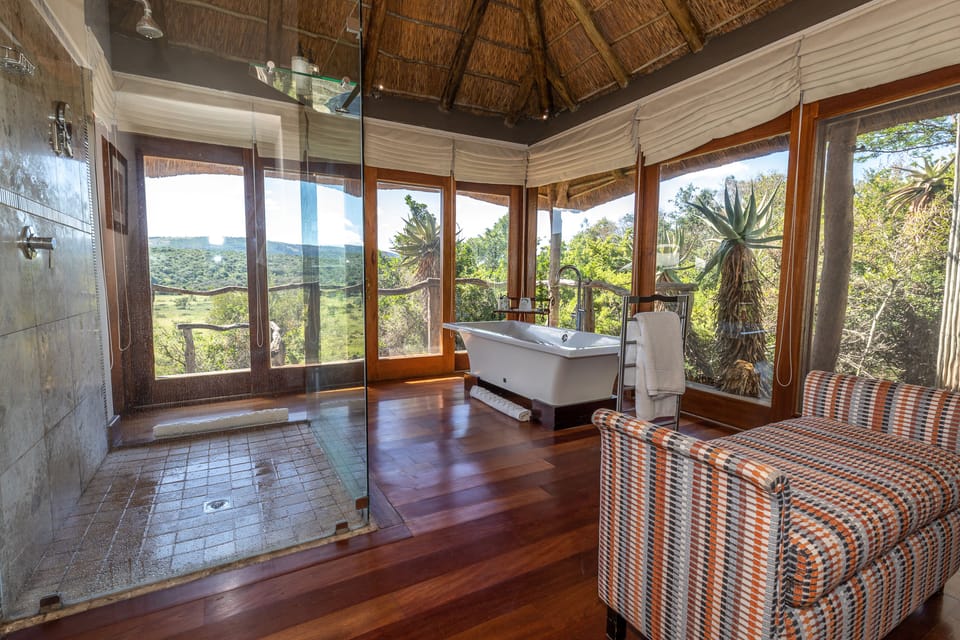 Msenge Chalet | Bathroom | Separate tub and shower, slippers, towels