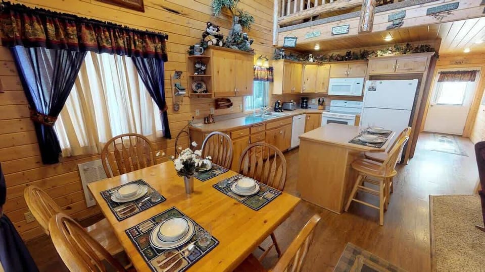 Upon entrance you are greeted by the dining table and kitchen.