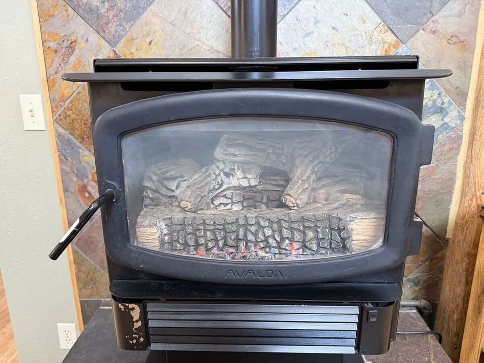 Fireplace located in the living room, make sure to bring your own wood.