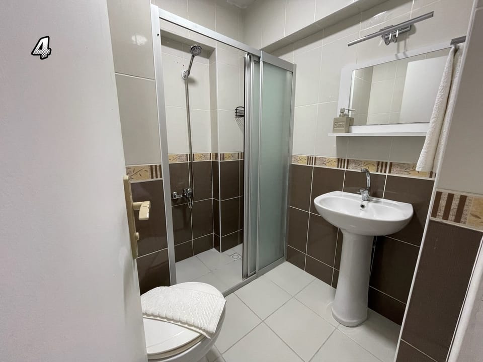 Standard Double Room, City View | Bathroom | Shower, free toiletries, hair dryer, slippers