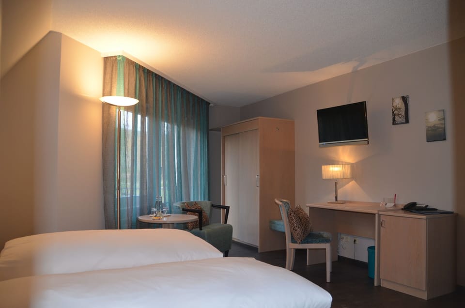 Double Room | Desk, blackout drapes, cribs (free), bed sheets