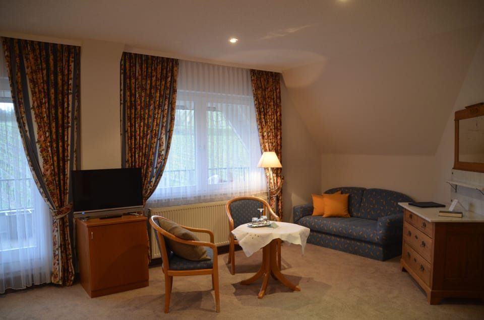 Triple Room | Living area | Flat-screen TV
