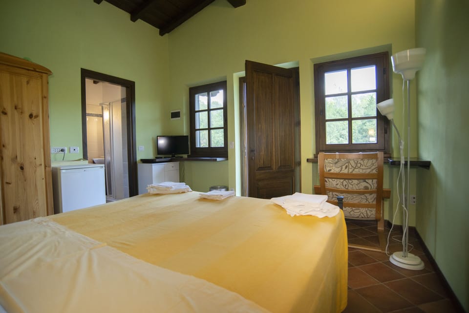 Double Room, Pool View | Iron/ironing board, bed sheets