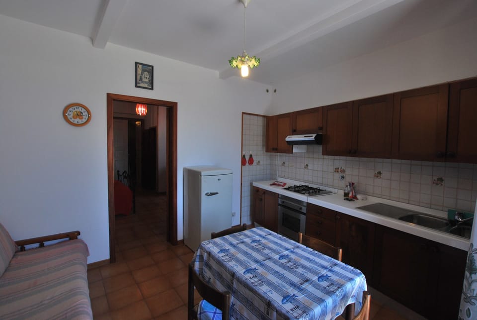 Apartment, 1 Bedroom | Private kitchen | Full-size fridge, stovetop, cookware/dishes/utensils